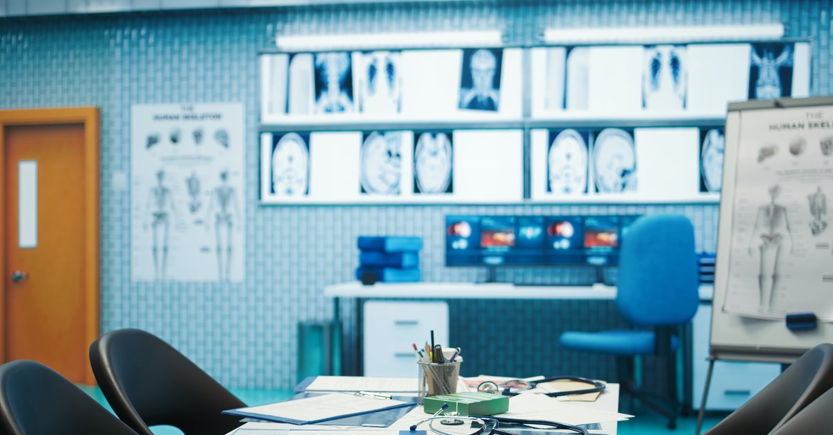 Medical office with X-ray scans, a desk and a stethoscope